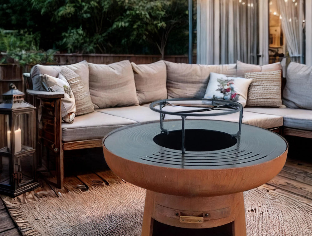 Barbecue rond avec plaque ronde en acier et grille en acier corten -